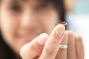 Woman trying on contact lens