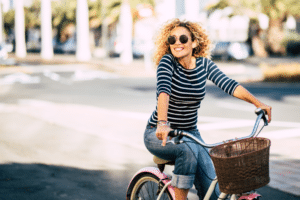 Woman riding a bike in the sun