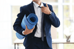 Business man with yoga mat