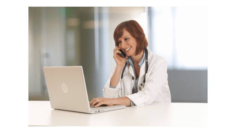 Female Doctor on the phone smiling - Medicash Best Doctors