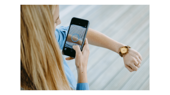Woman using SkinVision app to scan skin spot