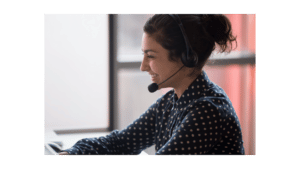 woman smiling while talking on the phone