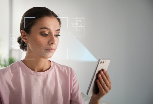 Woman using smartphone to scan face
