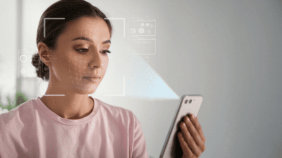 Woman using smartphone to scan face