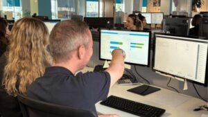 Medicash colleagues facing computer screens